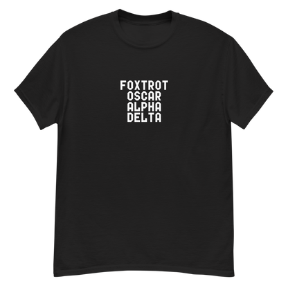 "Foxtrot Oscar Alpha Delta" printed on a black unisex classic tee laying on a flat surface