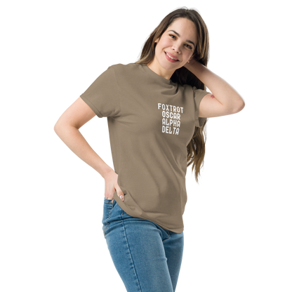"Foxtrot Oscar Alpha Delta" printed on a brown savana unisex classic tee worn by a female