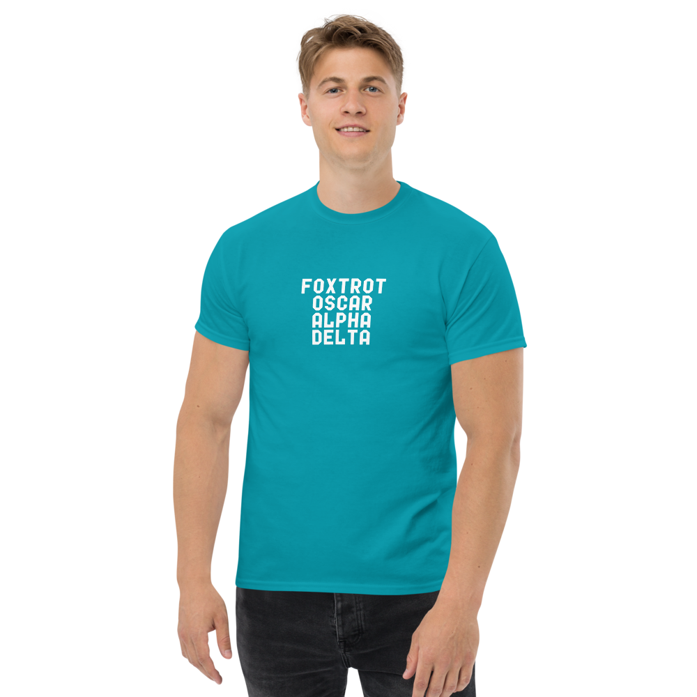 "Foxtrot Oscar Alpha Delta" printed on a tropical blue unisex classic tee worn by a male