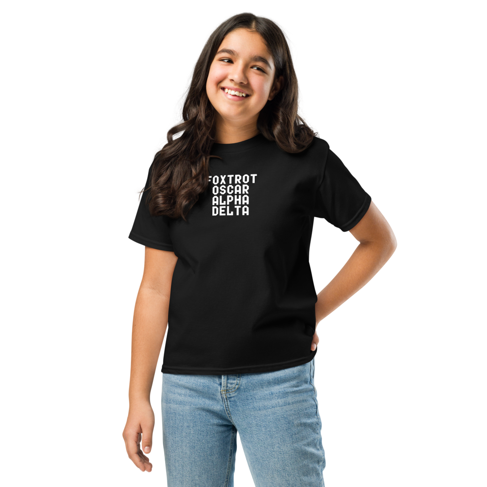 "Foxtrot Oscar Alpha Delta" printed on a black youth classic tee worn by a female
