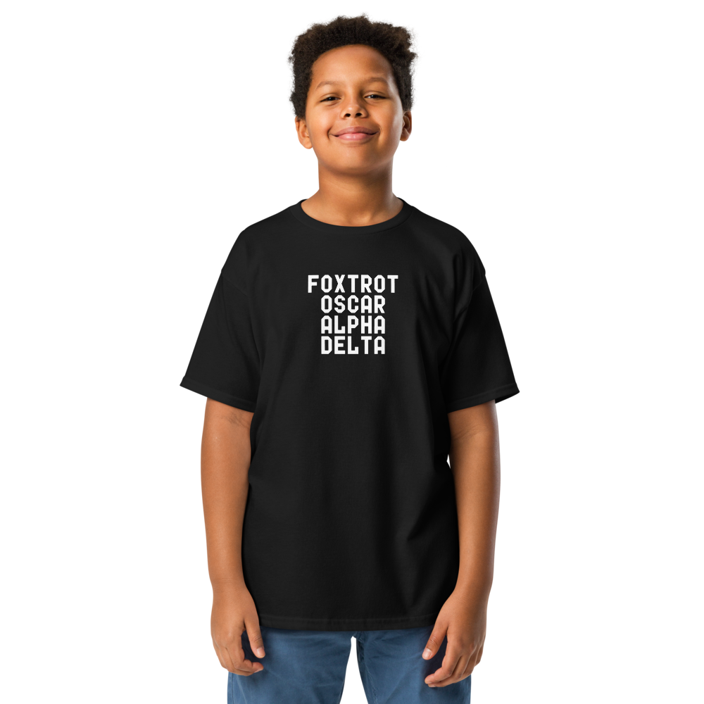 "Foxtrot Oscar Alpha Delta" printed on a black youth classic tee worn by a male