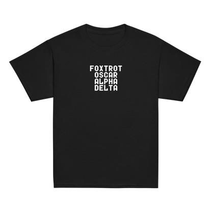 "Foxtrot Oscar Alpha Delta" printed on a black youth classic tee laying on a flat surface