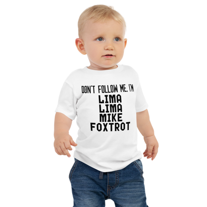 "Don’t follow me, I'm Lima Lima Mike Foxtrot" printed on a white baby jersey short sleeve tee worn by a male