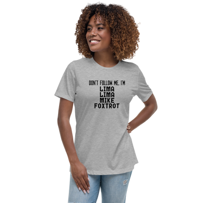 "Don’t follow me, I'm Lima Lima Mike Foxtrot" printed on a athletic heather women's relaxed t-shirt worn by a female
