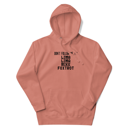 "Don’t follow me, I'm Lima Lima Mike Foxtrot" printed on a dusty rose unisex hoodie laying on a flat surface with the hood up