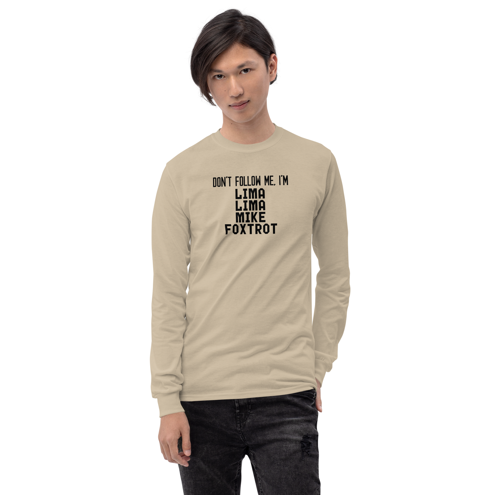 "Don’t follow me, I'm Lima Lima Mike Foxtrot" printed on a sand men's long sleeve shirt worn by a male