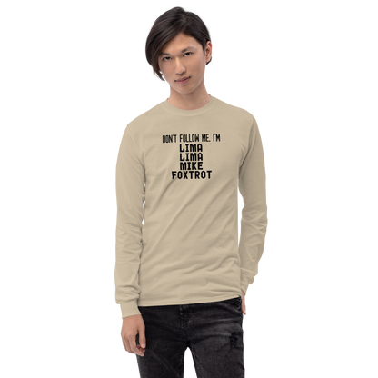 "Don’t follow me, I'm Lima Lima Mike Foxtrot" printed on a sand men's long sleeve shirt worn by a male
