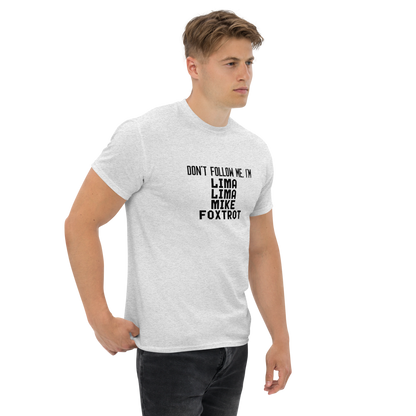"Don’t follow me, I'm Lima Lima Mike Foxtrot" printed on a ash unisex classic tee worn by a male
