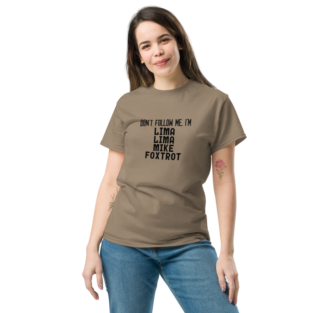 "Don’t follow me, I'm Lima Lima Mike Foxtrot" printed on a brown savana unisex classic tee worn by a female