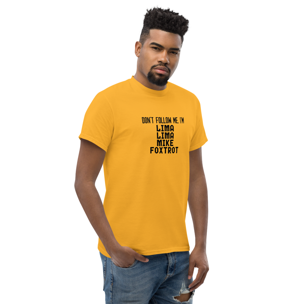 "Don’t follow me, I'm Lima Lima Mike Foxtrot" printed on a gold unisex classic tee worn by a male