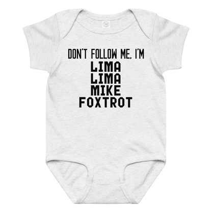 "Don’t follow me, I'm Lima Lima Mike Foxtrot" printed on a ash baby jersey bodysuit laying on a flat surface amongst other clothes