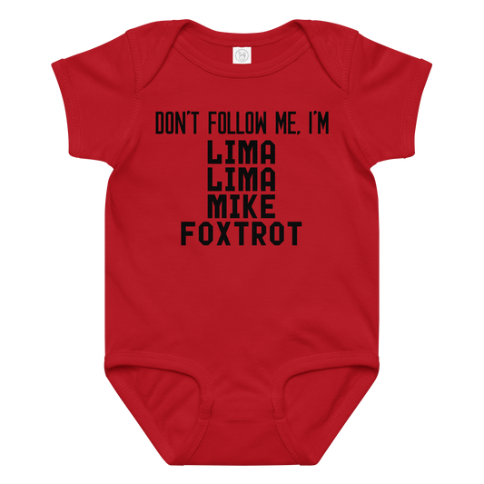 "Don’t follow me, I'm Lima Lima Mike Foxtrot" printed on a red baby jersey bodysuit laying on a flat surface amongst other clothes