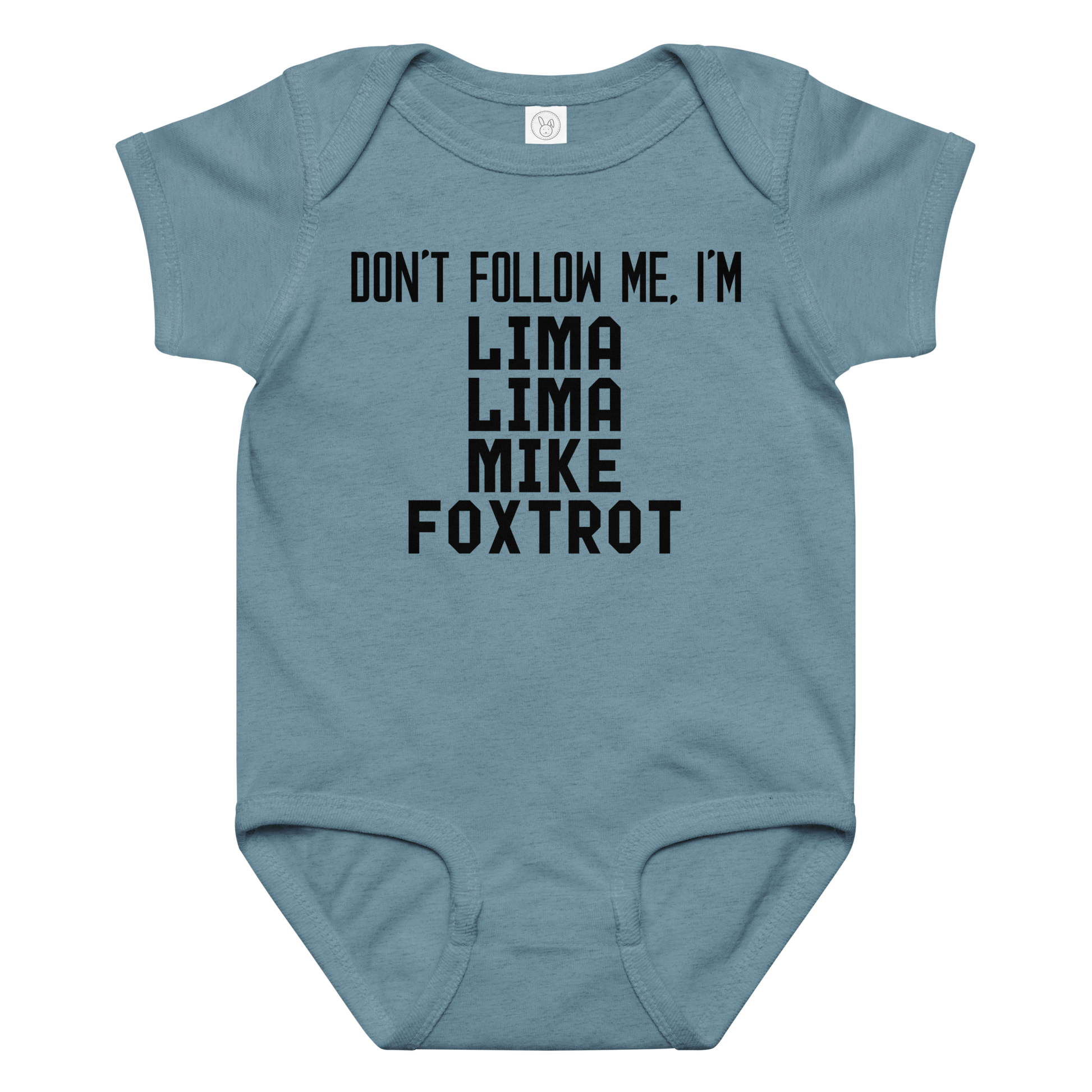"Don’t follow me, I'm Lima Lima Mike Foxtrot" printed on a vintage indigo baby jersey bodysuit laying on a flat surface amongst other clothes