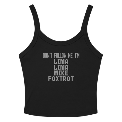 "Don’t follow me, I'm Lima Lima Mike Foxtrot" printed on a solid black blend women's micro-rib tanktop laying on a flat surface amongst sunglasses and shorts