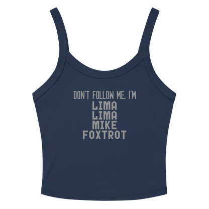 "Don’t follow me, I'm Lima Lima Mike Foxtrot" printed on a solid navy blend women's micro-rib tanktop laying on a flat surface amongst sunglasses and shorts
