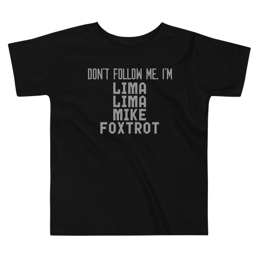 "Don’t follow me, I'm Lima Lima Mike Foxtrot" printed on a black toddler short sleeve tee laying on a flat surface