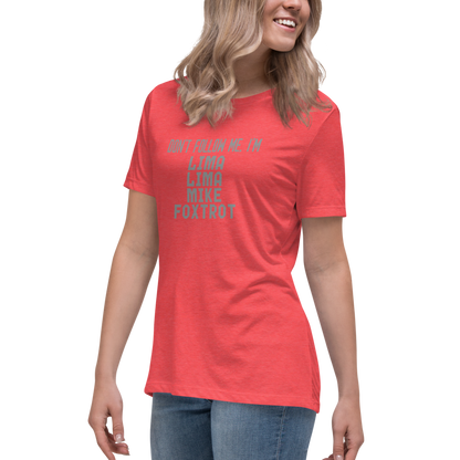 "Don’t follow me, I'm Lima Lima Mike Foxtrot" printed on a heather red women's relaxed t-shirt worn by a female