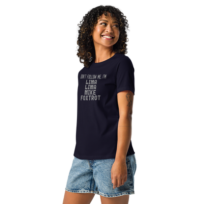 "Don’t follow me, I'm Lima Lima Mike Foxtrot" printed on a navy women's relaxed t-shirt worn by a female