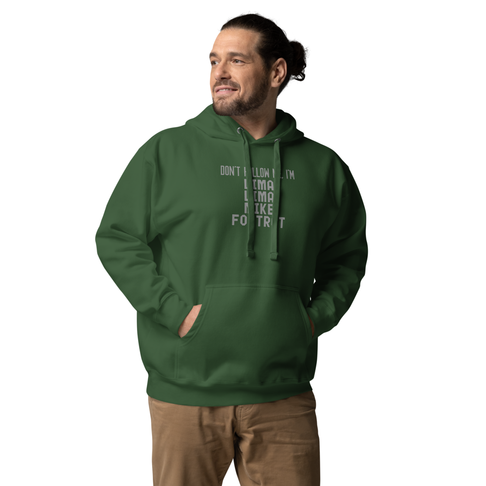 "Don’t follow me, I'm Lima Lima Mike Foxtrot" printed on a forest green unisex hoodie worn by a male