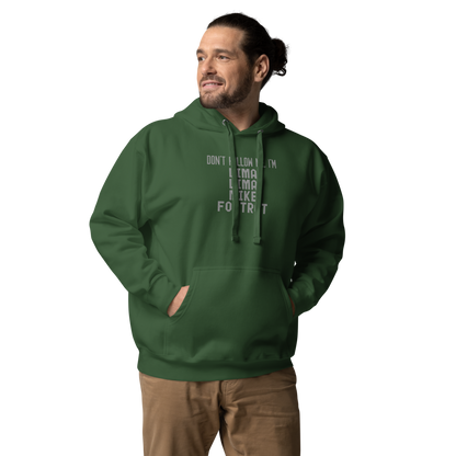 "Don’t follow me, I'm Lima Lima Mike Foxtrot" printed on a forest green unisex hoodie worn by a male