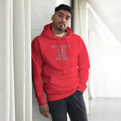"Don’t follow me, I'm Lima Lima Mike Foxtrot" printed on a team red unisex hoodie worn by a male