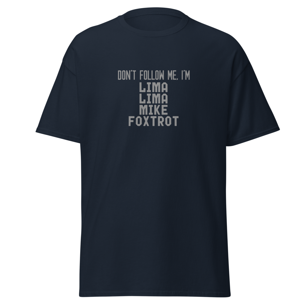"Don’t follow me, I'm Lima Lima Mike Foxtrot" printed on a navy unisex classic tee laying on a flat surface