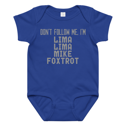 "Don’t follow me, I'm Lima Lima Mike Foxtrot" printed on a royal baby jersey bodysuit laying on a flat surface amongst other clothes