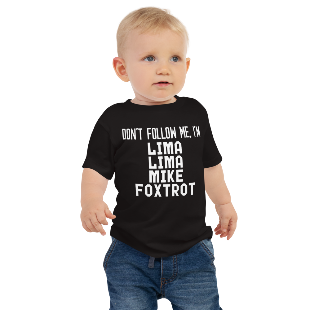 "Don’t follow me, I'm Lima Lima Mike Foxtrot" printed on a black baby jersey short sleeve tee worn by a male
