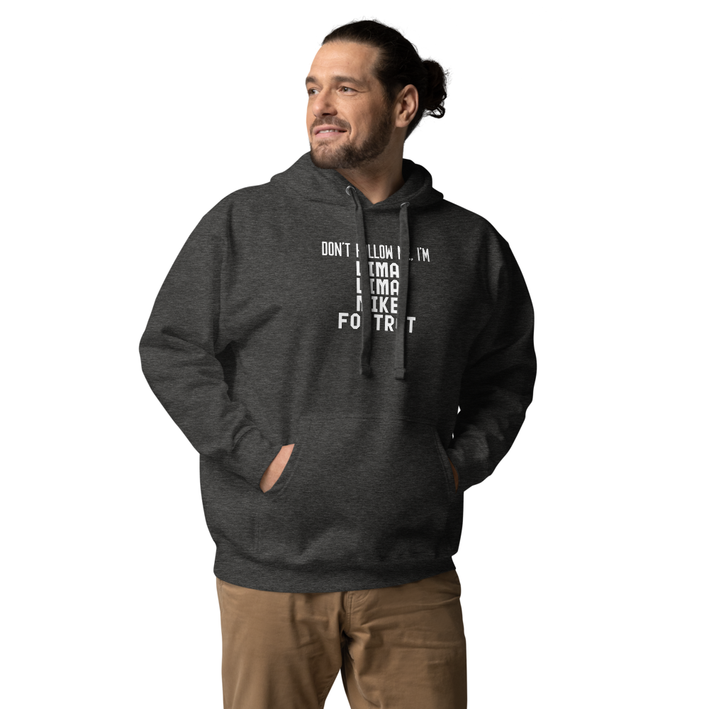 "Don’t follow me, I'm Lima Lima Mike Foxtrot" printed on a charcoal heather unisex hoodie worn by a male