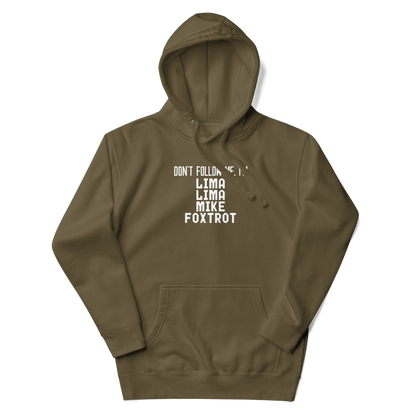"Don’t follow me, I'm Lima Lima Mike Foxtrot" printed on a military green unisex hoodie laying on a flat surface with the hood up