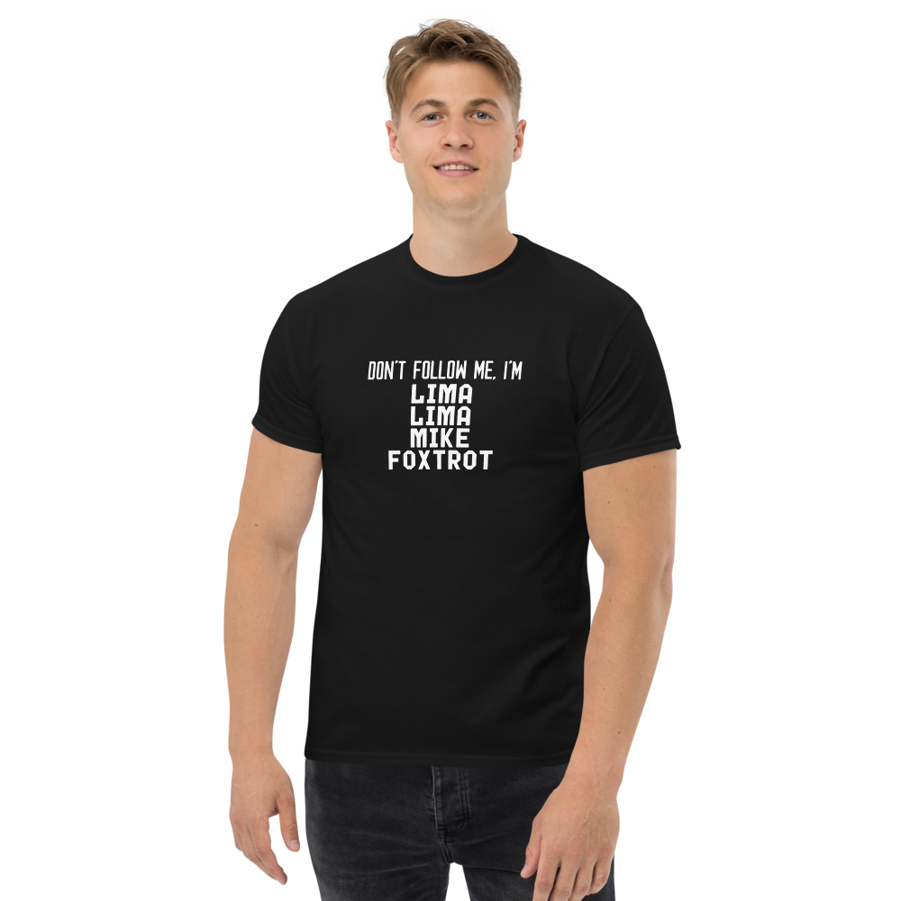 "Don’t follow me, I'm Lima Lima Mike Foxtrot" printed on a black unisex classic tee worn by a male