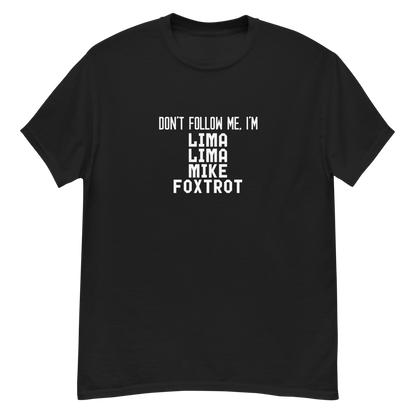 "Don’t follow me, I'm Lima Lima Mike Foxtrot" printed on a black unisex classic tee laying on a flat surface