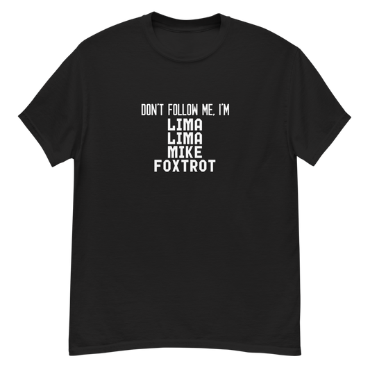 "Don’t follow me, I'm Lima Lima Mike Foxtrot" printed on a black unisex classic tee laying on a flat surface