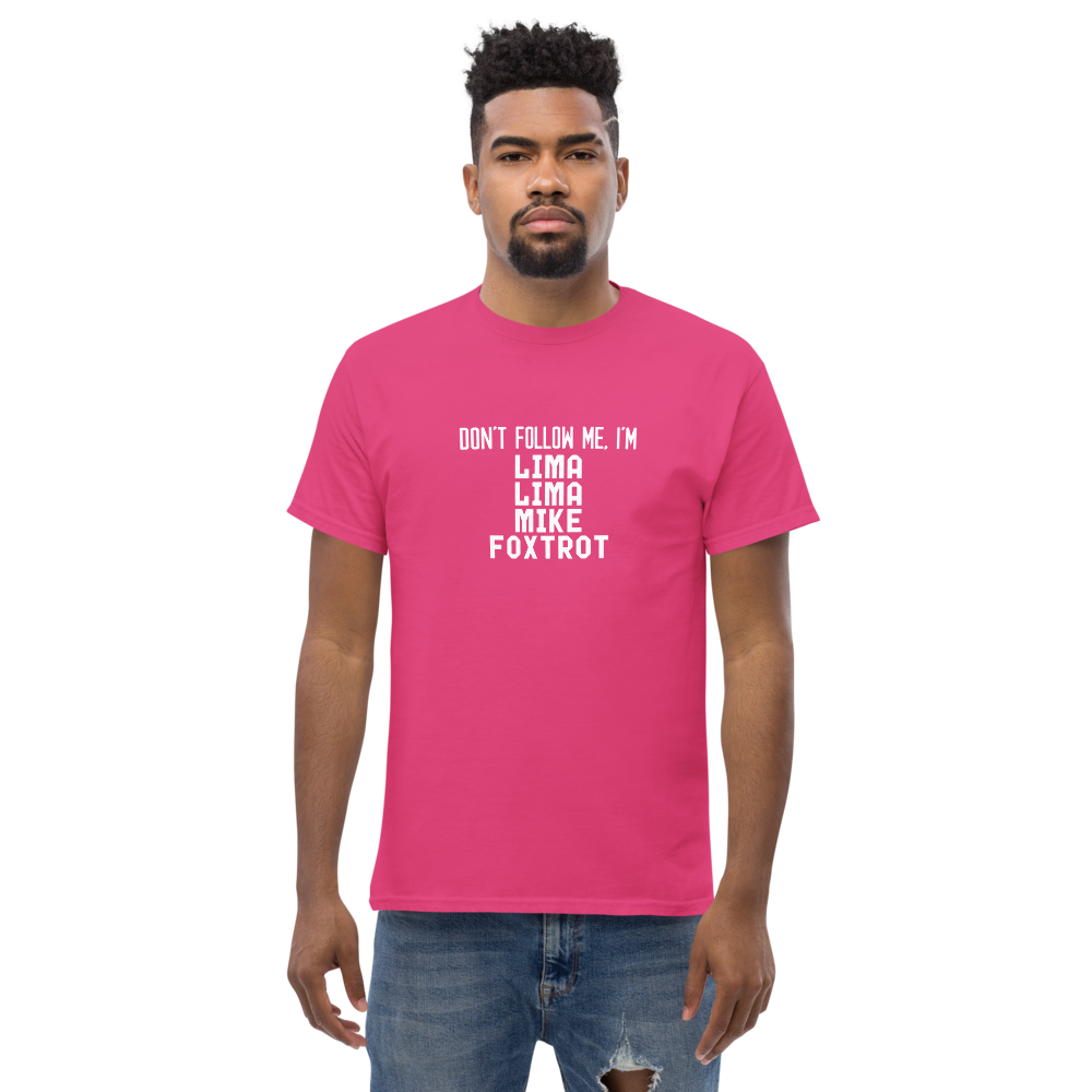 "Don’t follow me, I'm Lima Lima Mike Foxtrot" printed on a heliconia unisex classic tee worn by a male