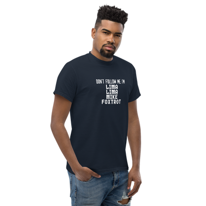 "Don’t follow me, I'm Lima Lima Mike Foxtrot" printed on a navy unisex classic tee worn by a male