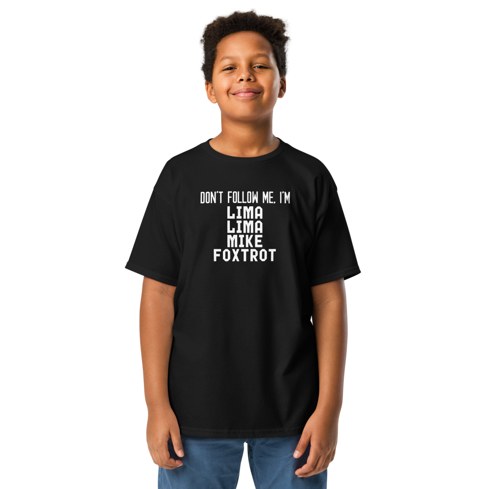 "Don’t follow me, I'm Lima Lima Mike Foxtrot" printed on a black youth classic tee worn by a male