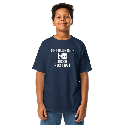 "Don’t follow me, I'm Lima Lima Mike Foxtrot" printed on a navy youth classic tee worn by a male