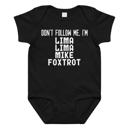 "Don’t follow me, I'm Lima Lima Mike Foxtrot" printed on a black baby jersey bodysuit laying on a flat surface amongst other clothes