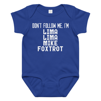 "Don’t follow me, I'm Lima Lima Mike Foxtrot" printed on a royal baby jersey bodysuit laying on a flat surface amongst other clothes
