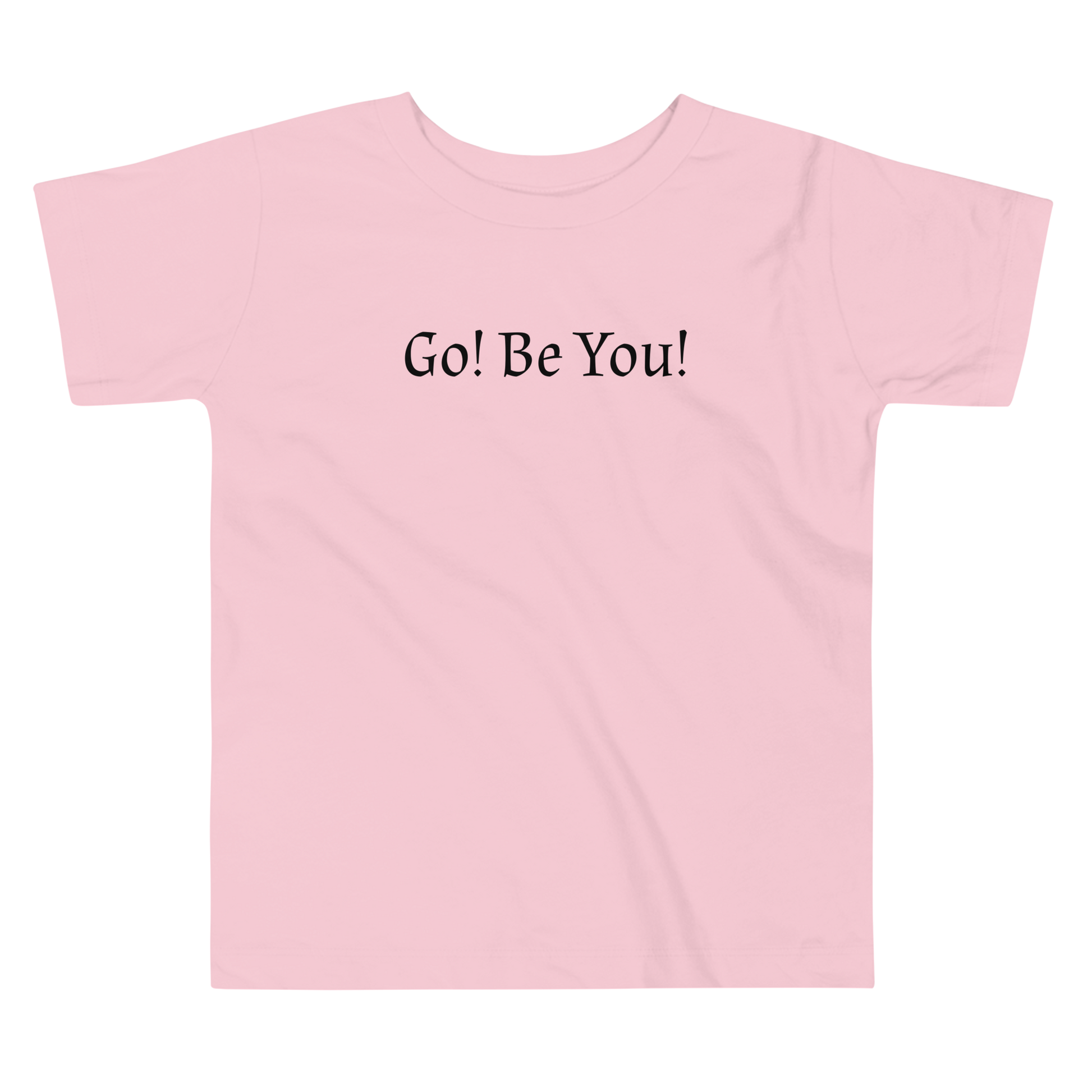 "Go! Be You!" printed on a pink toddler short sleeve tee laying on a flat surface