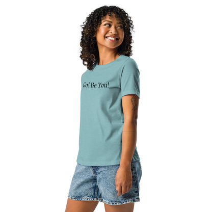 "Go! Be You!" printed on a heather blue lagoon women's relaxed t-shirt worn by a female