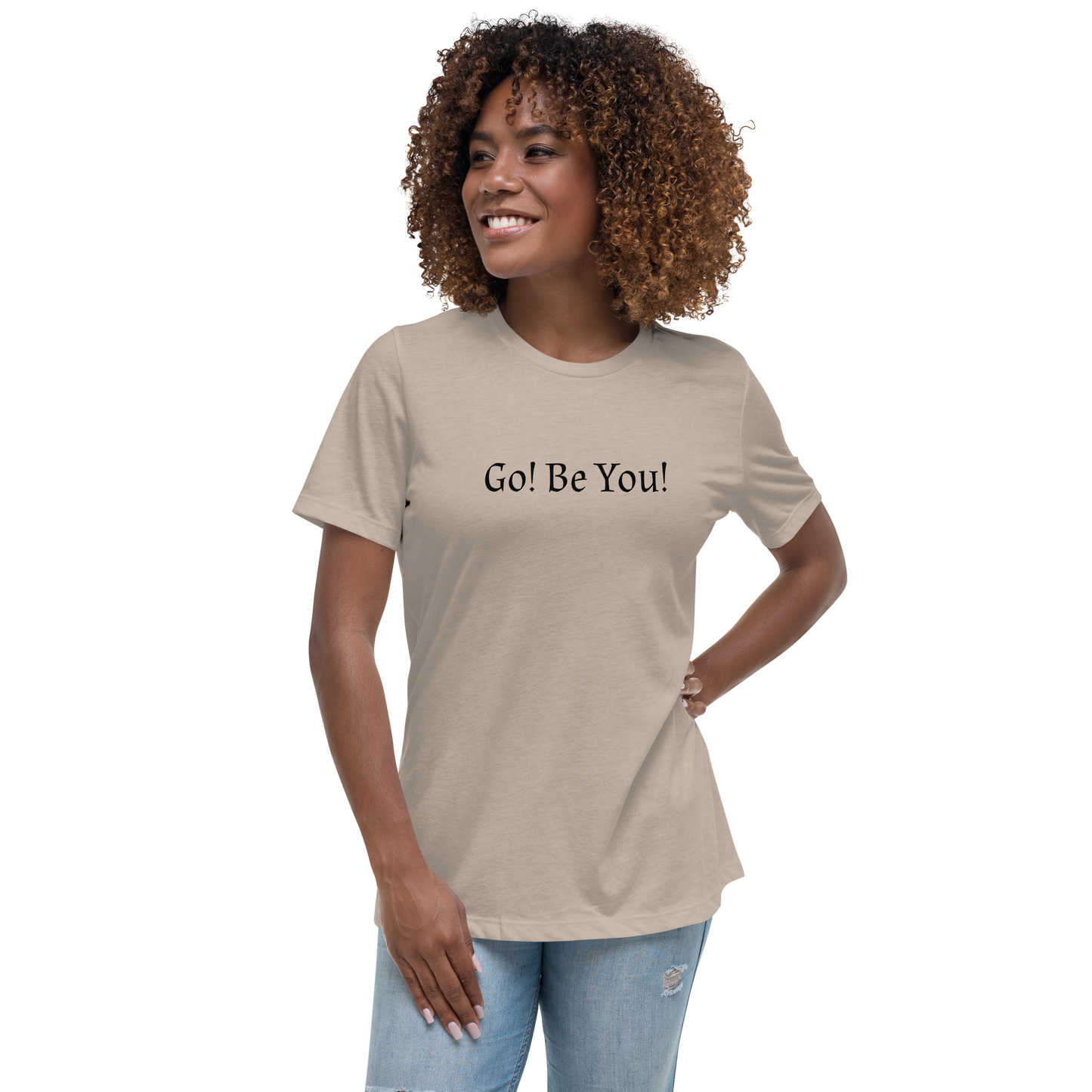 "Go! Be You!" printed on a heather stone women's relaxed t-shirt worn by a female