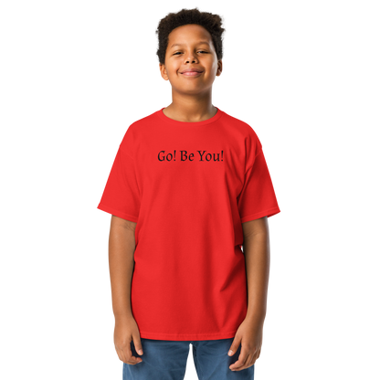 "Go! Be You!" printed on a red youth classic tee worn by a male