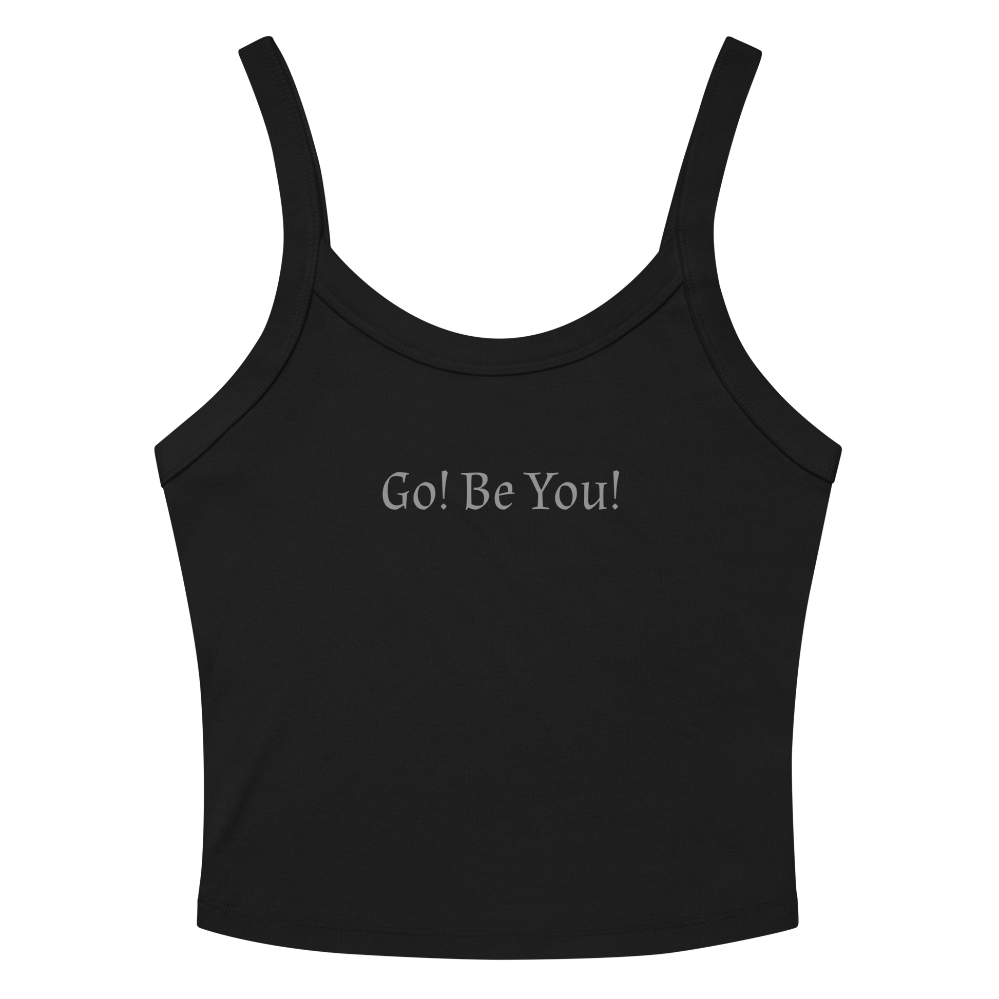 "Go! Be You!" printed on a solid black blend women's micro-rib tanktop laying on a flat surface amongst sunglasses and shorts