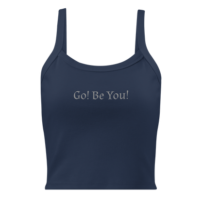 "Go! Be You!" printed on a solid navy blend women's micro-rib tanktop laying on a flat surface