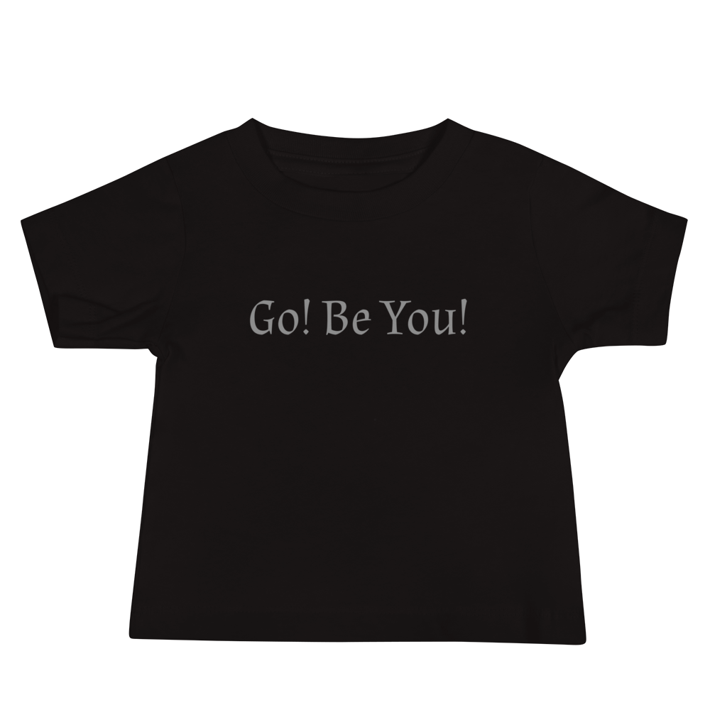 "Go! Be You!" printed on a black baby jersey short sleeve tee laying on a flat surface