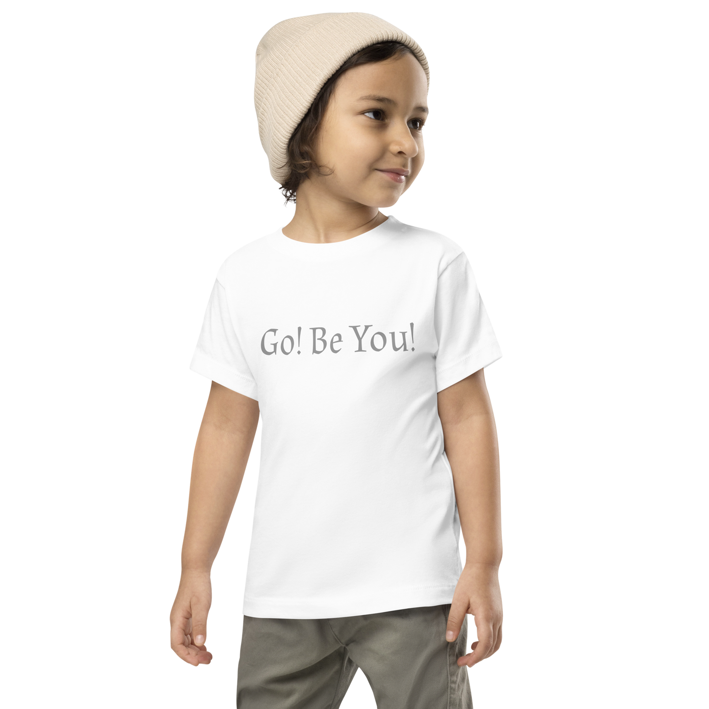 "Go! Be You!" printed on a white toddler short sleeve tee worn by a male wearing a cap