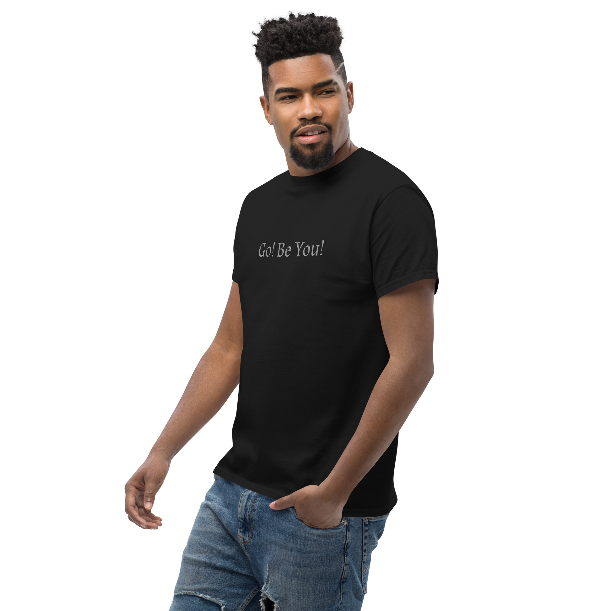 "Go! Be You!" printed on a black unisex classic tee worn by a male