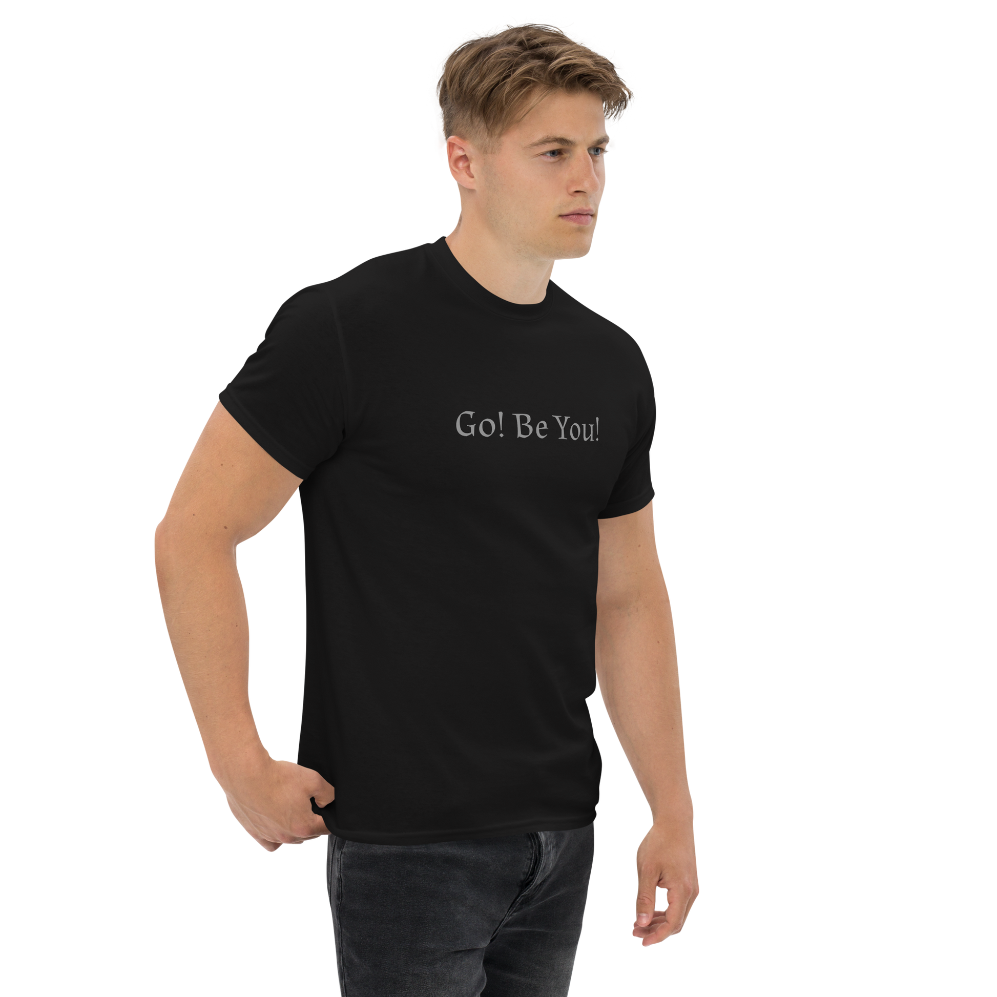 "Go! Be You!" printed on a black unisex classic tee worn by a male