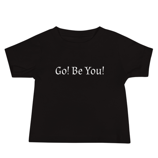 "Go! Be You!" printed on a black baby jersey short sleeve tee laying on a flat surface